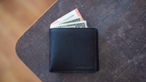 A stack of Kickstarter pledge forms with a red 'money gone' stamp over them