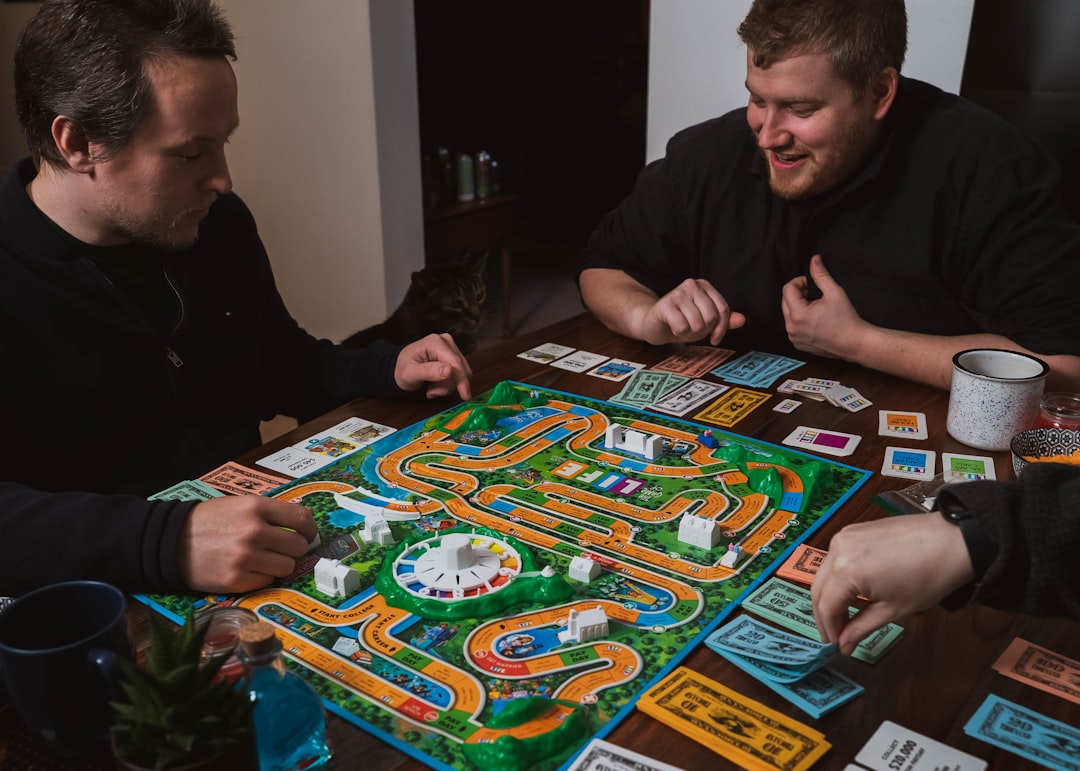 Two players collaborating over a complex board game setup
