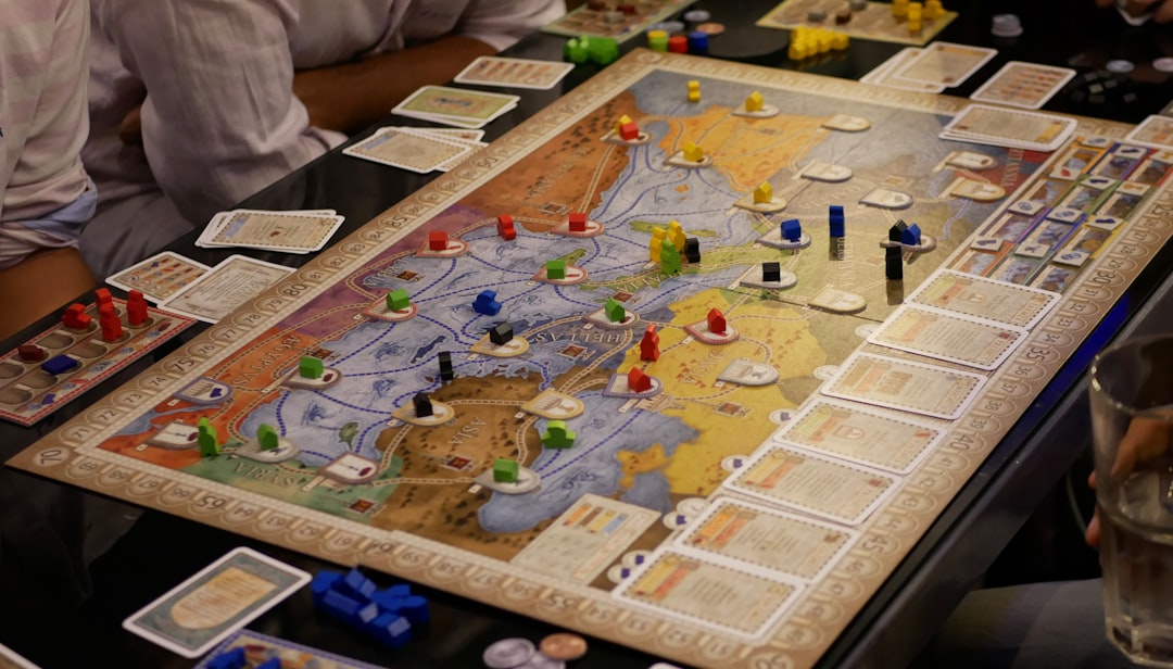 A colorful board game setup featuring five popular gateway board games 2026 titles on a wooden table.