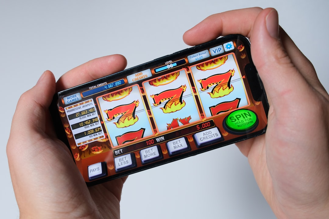 A close-up of a smartphone screen showing a colorful deck builder game interface with cards being drafted.