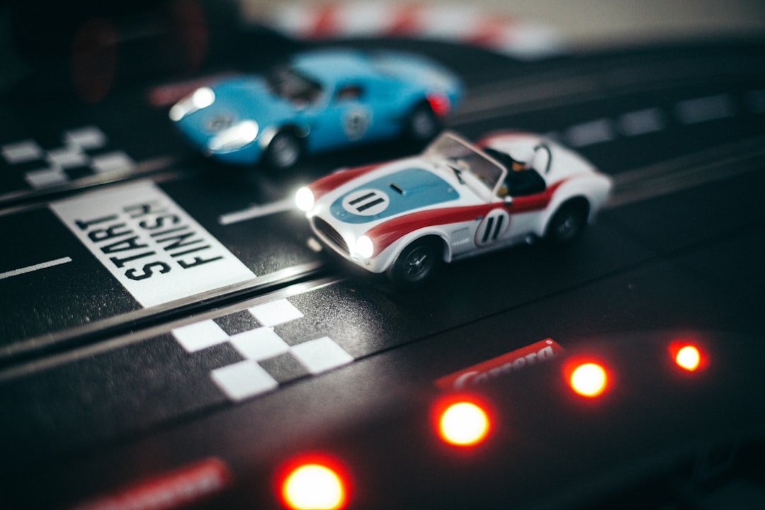 Heat: Pedal to the Metal board game setup showing cars on a track with cards in hand